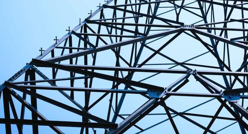 A photograph of the metal frames on an electrical tower.